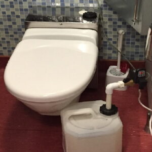 Automatic setup for dosing vacuum toilet descaling chemicals 