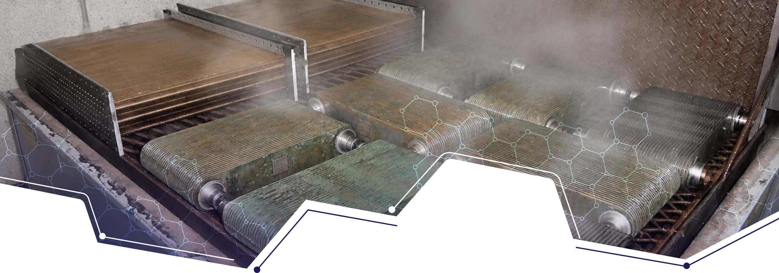 Industrial heat exchanger and cooler units undergoing hot alkaline cleaning in a heated cleaning tank